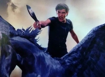 Detail from The Titan's Curse (Percy Jackson 3rd book) cover art - boy in a heroic pose on a winged horse 